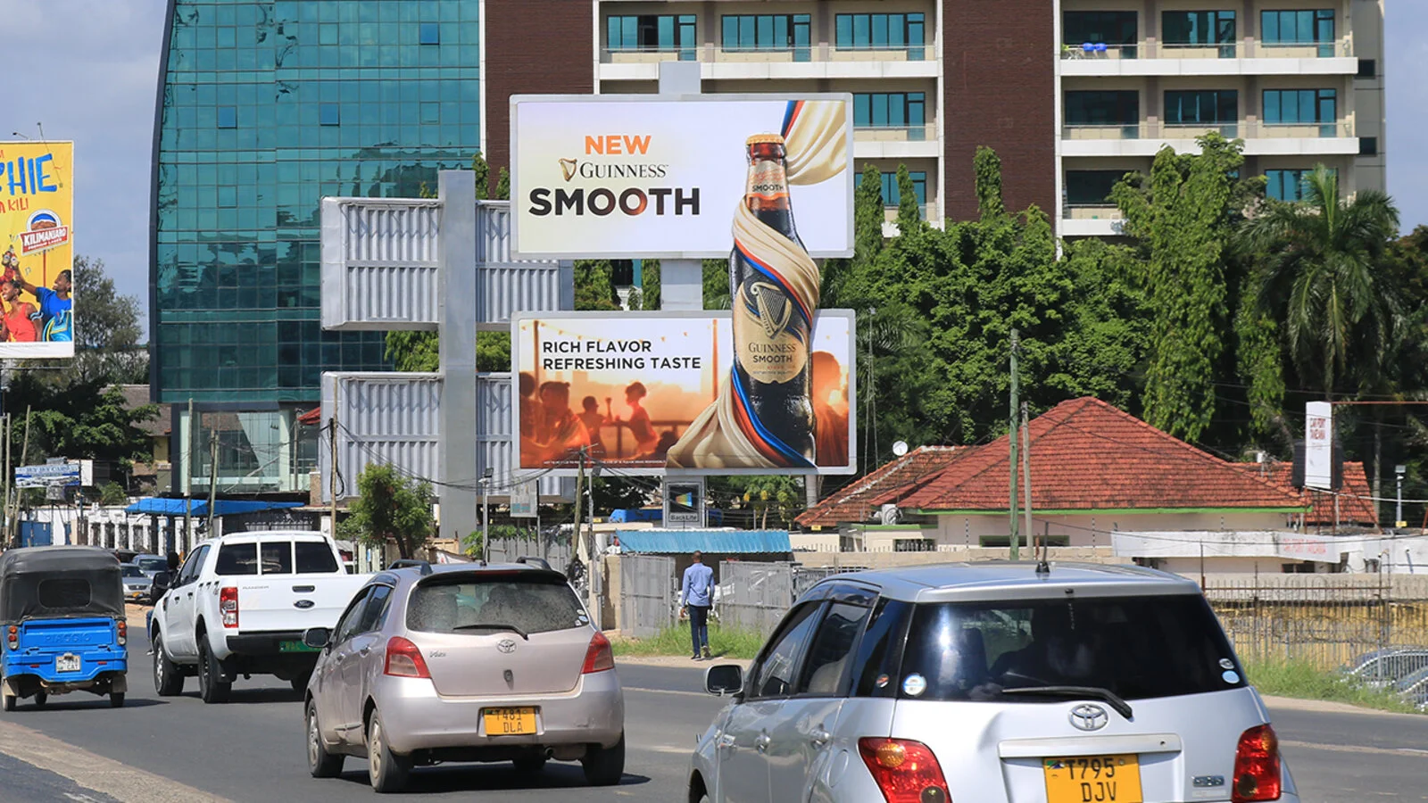 A Guinness Smooth double-decker board on a city street